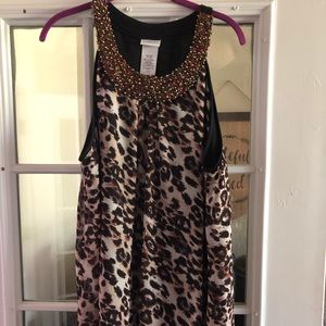Leopard sheer falls loosely over black lining